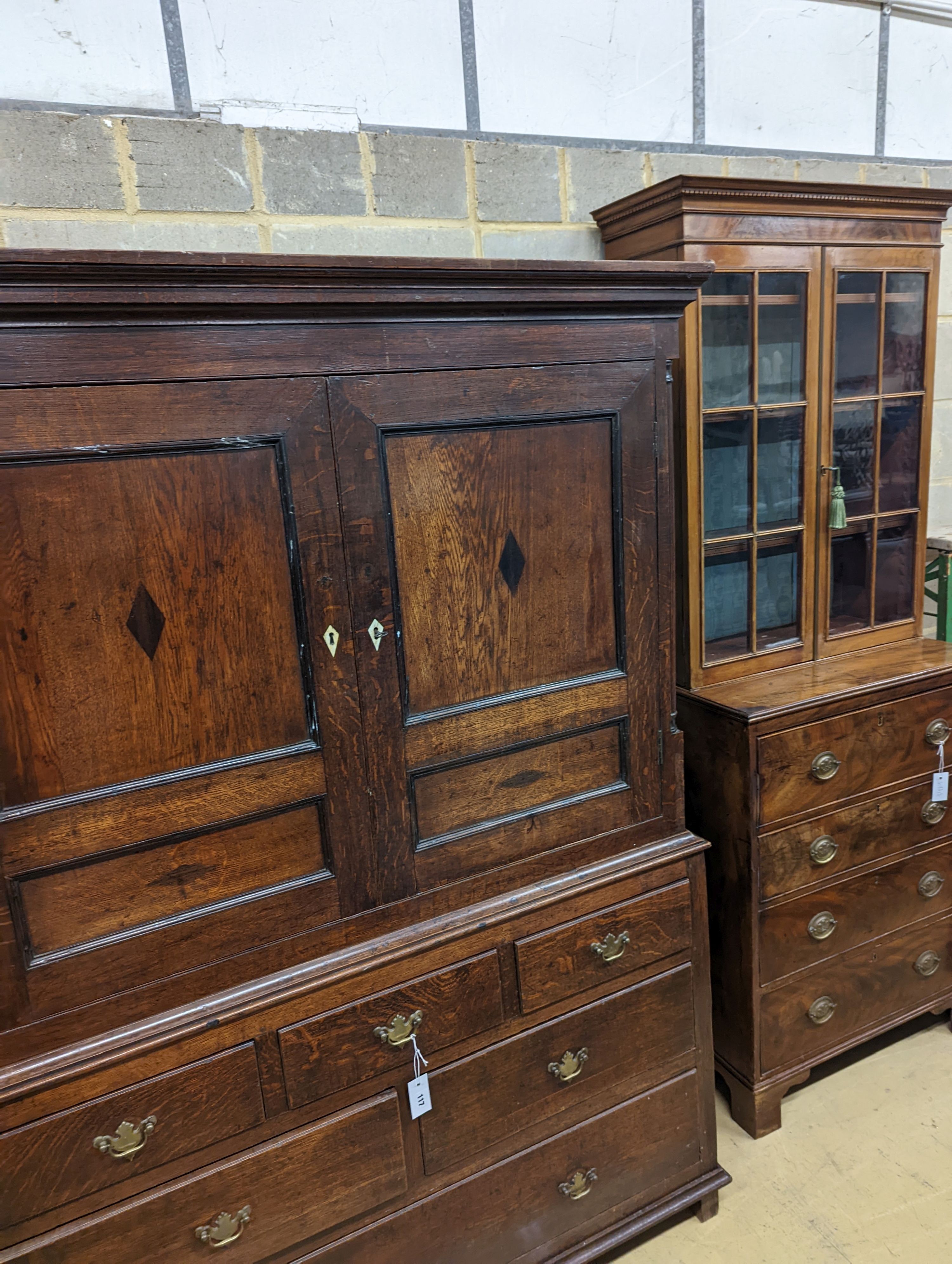 A George III oak press cupboard fitted six drawers, width 132cm, depth 54cm, height 187cm